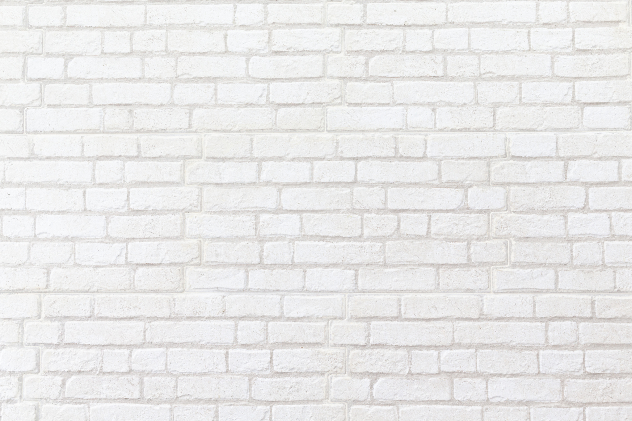 weathered white brick wall texture background.